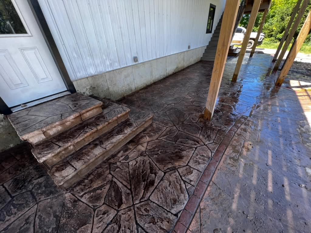 Stone-pattern stamped concrete patio, steps and decorative border
