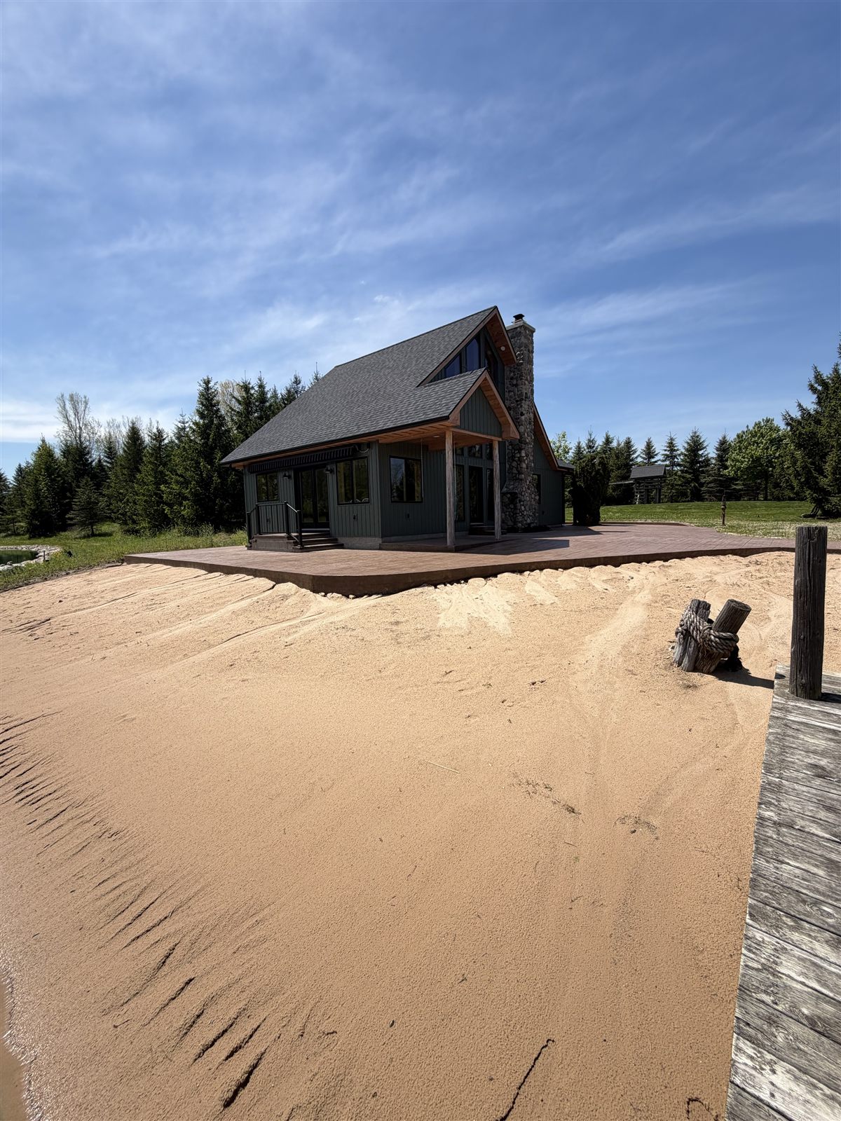 Side view of a cabin and surrounding concrete surface